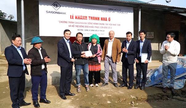 A group of people standing in front of a sign

AI-generated content may be incorrect.